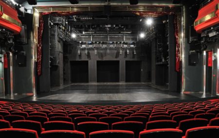 Empty theater stage and seating, ready for a performance